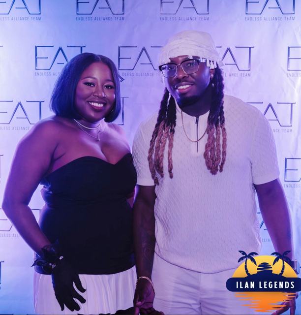 A couple posing at the photo booth