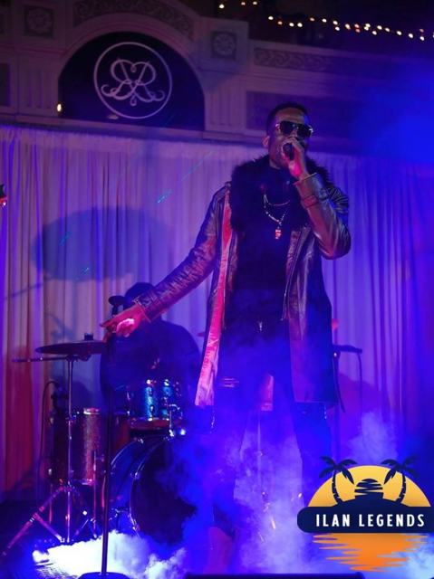 A singer performing in the haze
