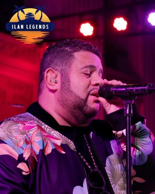 A vocalist in a floral jacket