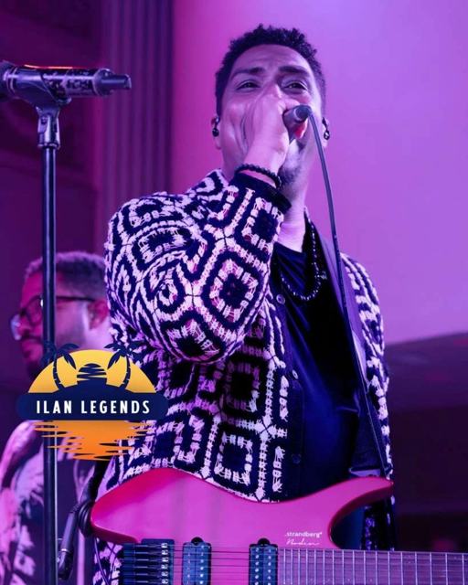 A singer-guitarist at the microphone