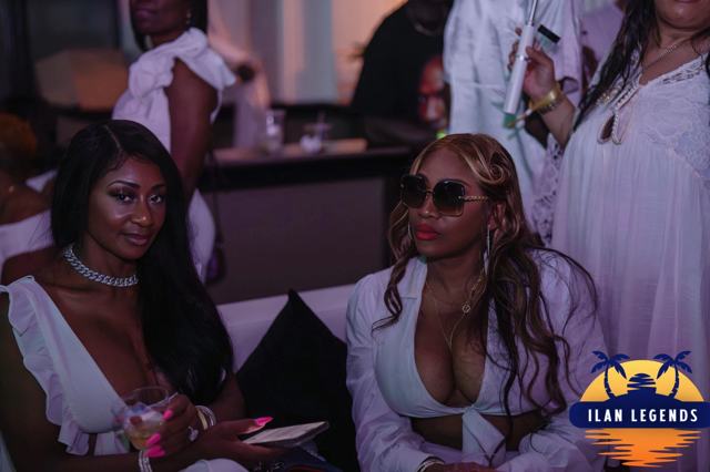 Guests in white relaxing in the lounge