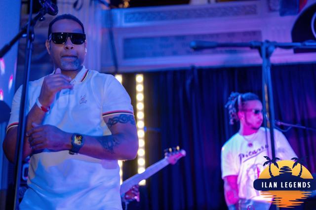 A singer in sunglasses on stage