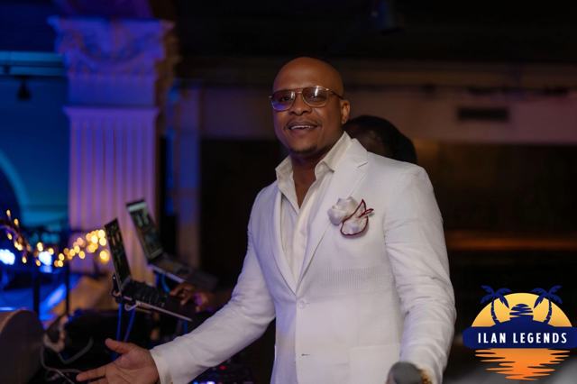 A guest in a white suit