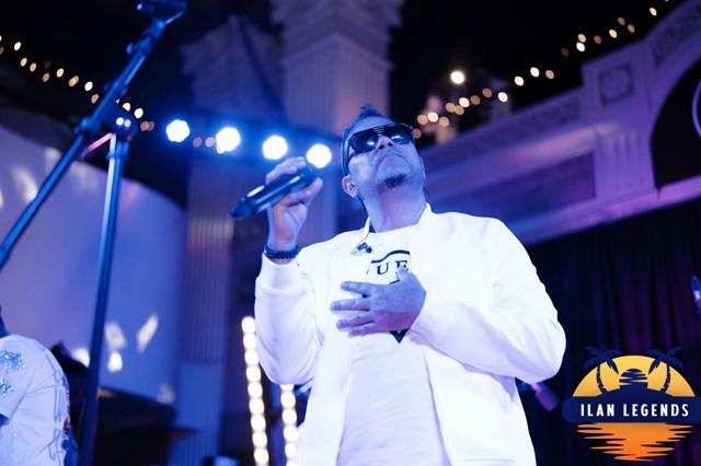 A singer performing in white
